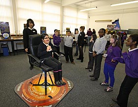 A girl on the Spinning Chair with an audience